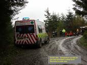 Competition car has left the road and is down a steep bank. Lace crew standing by whilst recovery is under way.