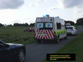 Competition car at a Sprint meeting spun through wooden fence into a field.